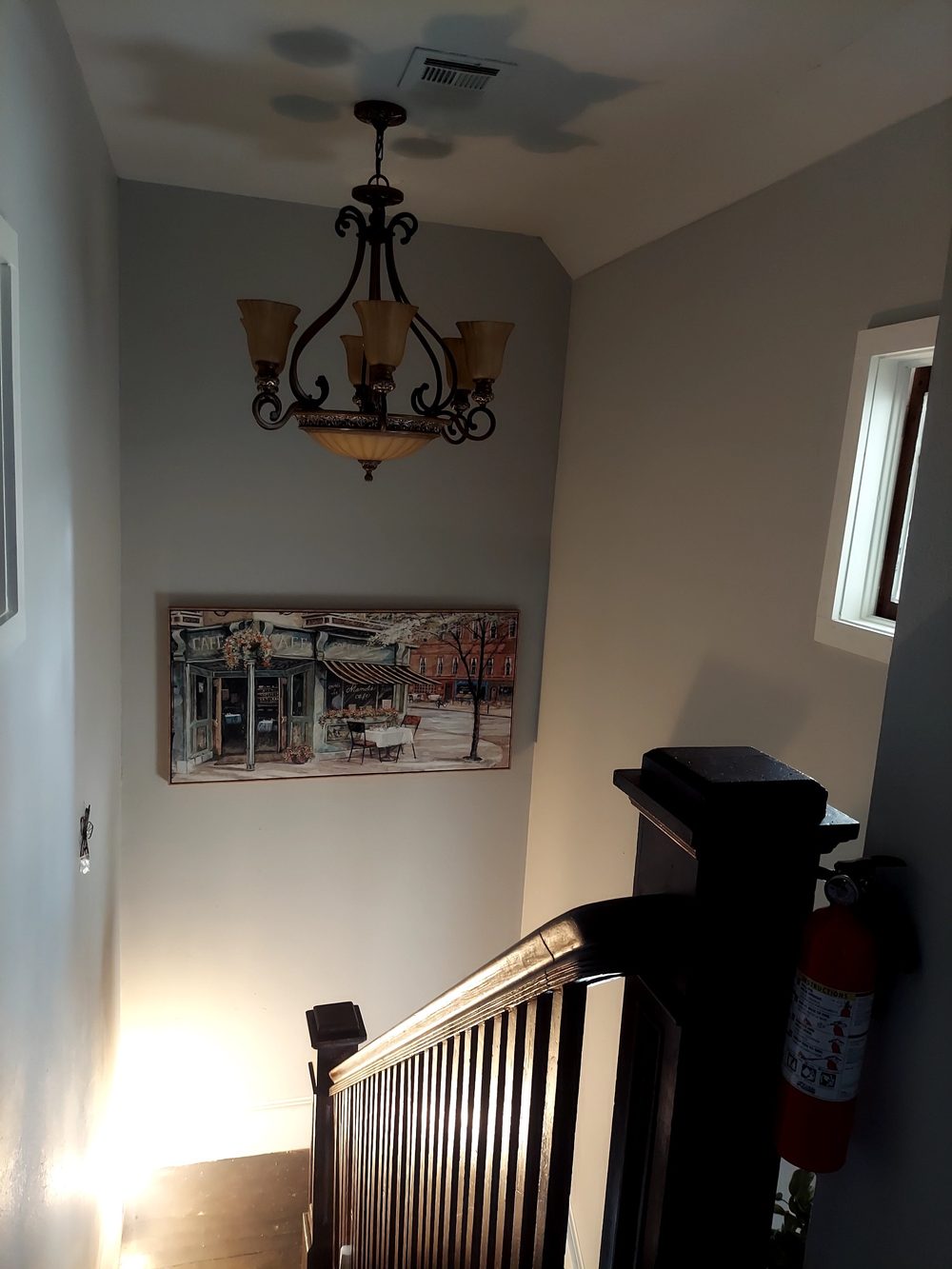 Grand stairway with wrought-iron chandelier